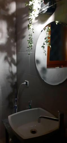 a bathroom with a sink and a mirror on the wall at Casa Pratolungo in Velletri