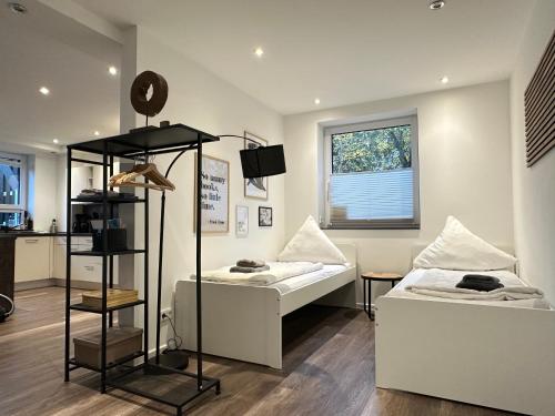 Ένα ή περισσότερα κρεβάτια σε δωμάτιο στο M&K Homes Eleganter Neubau zwischen Hamburg&Ostsee mit Parkplatz