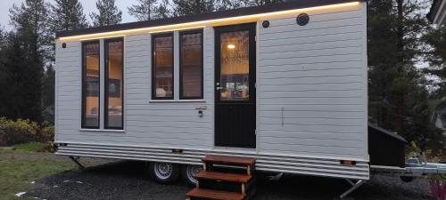 a tiny house is sitting on a trailer at Santa's little cottage in Rovaniemi