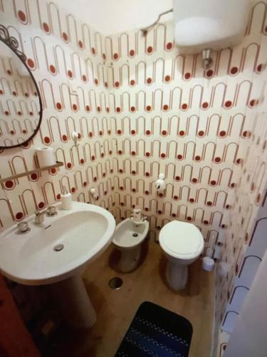a bathroom with a sink and a toilet at A casa di Giulia in Filettino Graziani