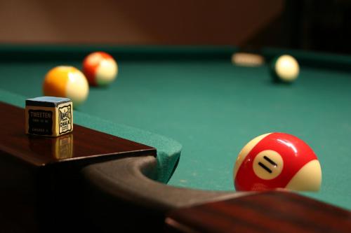 a red billiard balls on a pool table at Casa de Estoi in Estói