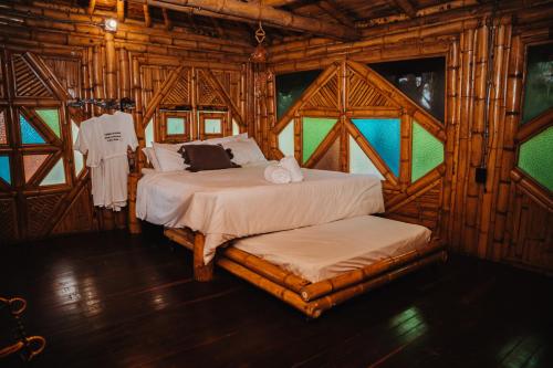 Ένα ή περισσότερα κρεβάτια σε δωμάτιο στο Ecohotel Tierra de Agua