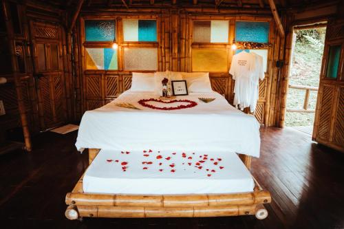 Ένα ή περισσότερα κρεβάτια σε δωμάτιο στο Ecohotel Tierra de Agua