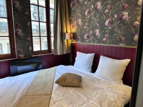 Ένα ή περισσότερα κρεβάτια σε δωμάτιο στο The Place Brussels