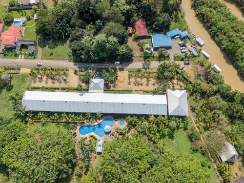 an aerial view of a house with a swimming pool at Casa del Sol - Poolside Villa in Quepos
