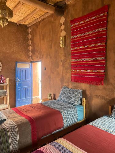 Ένα ή περισσότερα κρεβάτια σε δωμάτιο στο Kasbah Mashallah