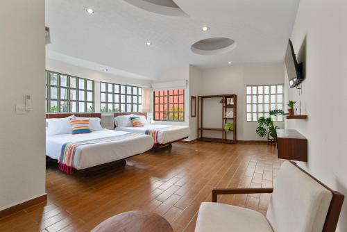 Ένα ή περισσότερα κρεβάτια σε δωμάτιο στο Casa Quinta Luna Guest house Near to Cancun air port