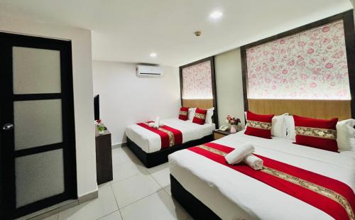 Postel nebo postele na pokoji v ubytování Elite Hotel KL Sentral