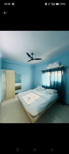 En eller flere senge i et værelse på Sai vacation Home