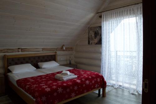 Ένα ή περισσότερα κρεβάτια σε δωμάτιο στο Садиба Кичера Еко