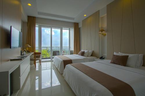 A bed or beds in a room at R Hotel Rancamaya