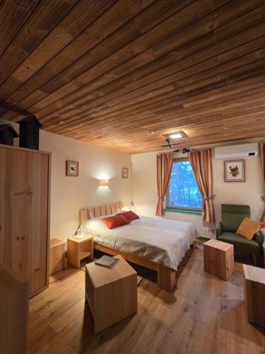 a bedroom with a bed and a large window at Gintarautojai in Palanga