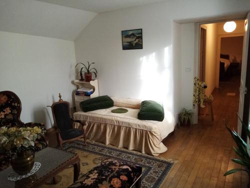 Ένα ή περισσότερα κρεβάτια σε δωμάτιο στο Maïstine - Chambres d hôte