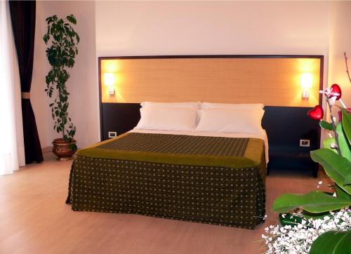 Postel nebo postele na pokoji v ubytování Il Grillo Hotel