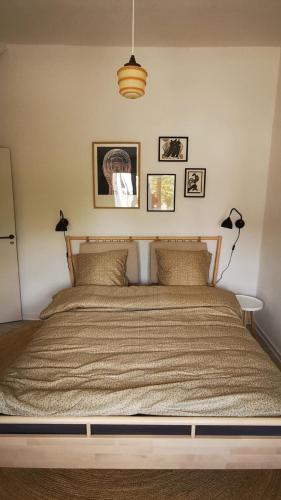 a bedroom with a large bed with two pillows at BnB Hammerum in Herning