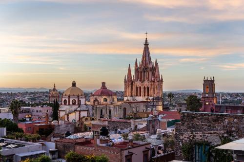 a view of a city with a cathedral at Le Cottage San Miguel de Allende, Modern Luxury in Centro with Pool & Jacuzzi in San Miguel de Allende