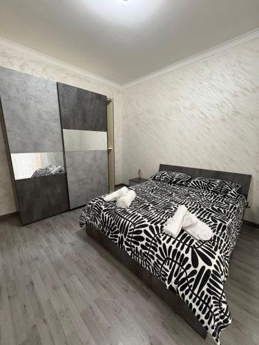 Un pat sau paturi într-o cameră la Gioeni PARK HOUSE