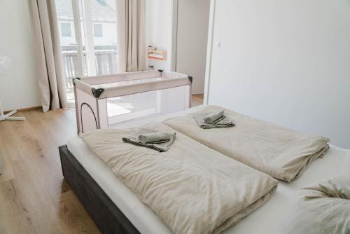 Ένα ή περισσότερα κρεβάτια σε δωμάτιο στο Ferienwohnung Emilia am Wörthersee