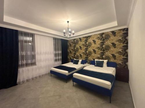 Una cama o camas en una habitación de Iridam De-Luxe