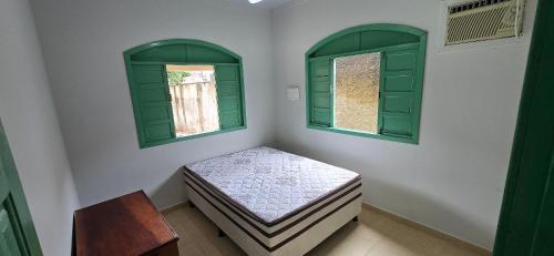 En eller flere senge i et værelse på Casa Temporada Maré Alta