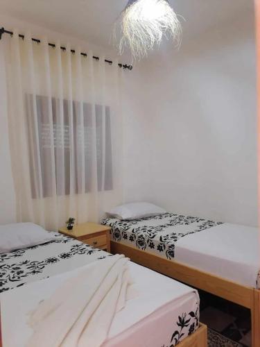 two beds sitting next to each other in a room at Le P’tit Coin D’Akchour in Akchour