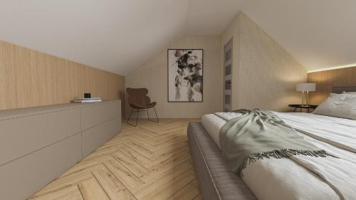 a bedroom with a large bed and a chair at Aqua & Wellness resort Alzbeta in Liptovský Mikuláš