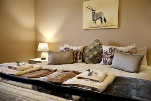 a large bed with towels on top of it at Uitvlugt Ponds in Dullstroom