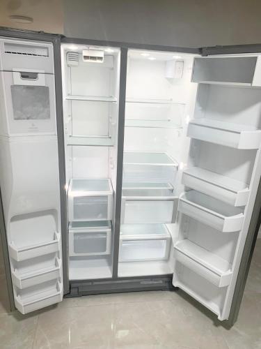 an empty refrigerator with its doors open in a kitchen at Peace and Quiet Dorm Rooms - Free Breakfast DIY Waffles - Free Dinner - Free Coffee - Longterm Ok! in Miami