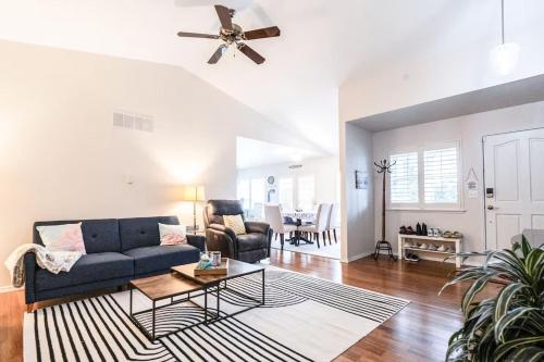 a living room with a couch and a table at Charming beach home with Ocean & Mt. Baker View in Camano