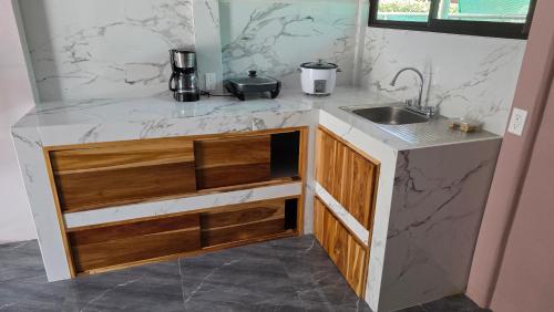 Η κουζίνα ή μικρή κουζίνα στο Paquera apartment