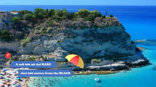 a hot air balloon flying over a small island at B&B Le Grazie Tropea in Tropea