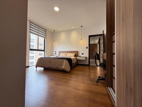 A bed or beds in a room at Garzonier de lujo
