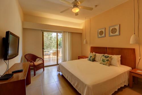 Llit o llits en una habitació de Riviera Maya Suites