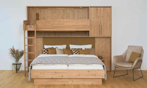 Postel nebo postele na pokoji v ubytování Haus Central Lofer