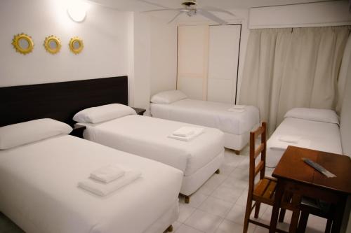 Ένα ή περισσότερα κρεβάτια σε δωμάτιο στο Hotel Altos del Norte