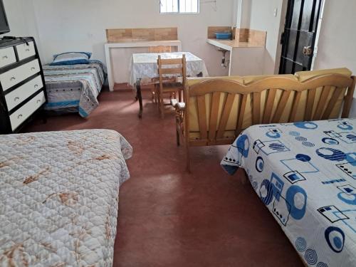 Ένα ή περισσότερα κρεβάτια σε δωμάτιο στο Casa de Campo y Hospedaje Irma