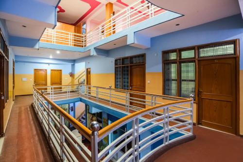 an indoor pool in a building with blue walls at SPOT ON Kailash Hotel in Chūharpur