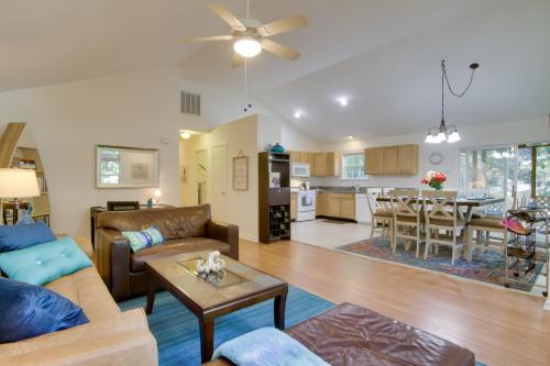 a living room with a couch and a table at Pool, Trail Access! Dog-Friendly Ocean Pines Haven in Ocean Pines