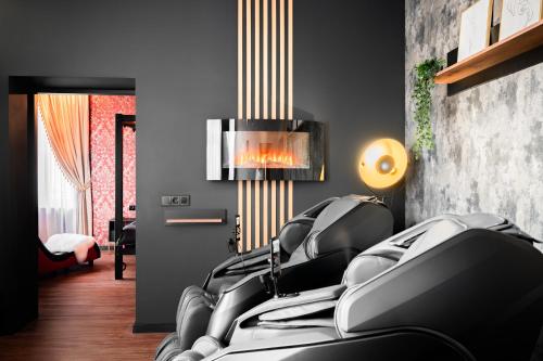 a living room with a bunch of black chairs at Apartament Organza - Private Gym - Spa - Free Parking in Toruń