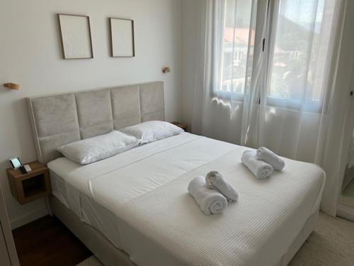 En eller flere senge i et værelse på Bellavista Residence