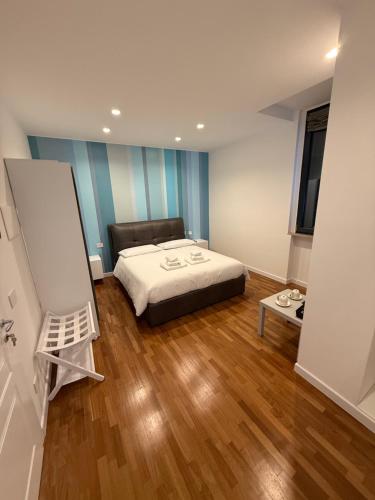 Ένα ή περισσότερα κρεβάτια σε δωμάτιο στο Sarminia