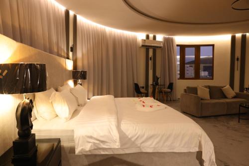 Ένα ή περισσότερα κρεβάτια σε δωμάτιο στο Jood Alula Apartment