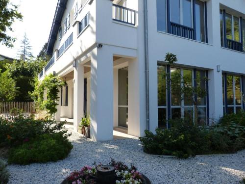 a white building with some flowers in front of it at Dorre Pean in Ciboure