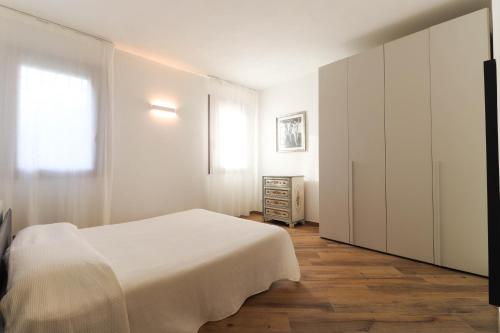 Postel nebo postele na pokoji v ubytování Appartamento 2 Leoni