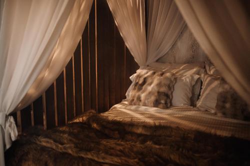 Ένα ή περισσότερα κρεβάτια σε δωμάτιο στο Caseddu SPA Chalet