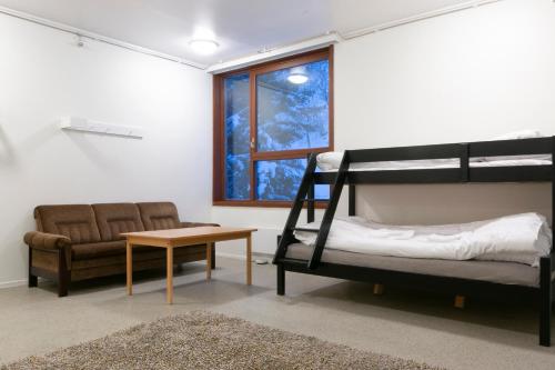 Ένα ή περισσότερα κρεβάτια σε δωμάτιο στο Senja Fjord Lodge