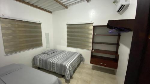 En eller flere senge i et værelse på FamiliaV&B