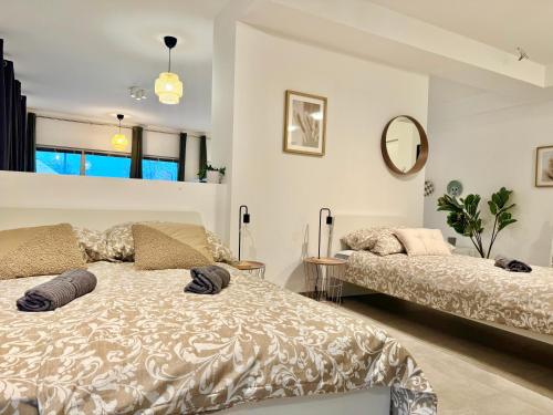 Ένα ή περισσότερα κρεβάτια σε δωμάτιο στο Stylish Modern Apartment with Patio near Vienna