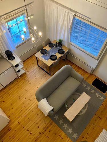 a living room with a couch and a table at Villa Adalia in Kalajoki