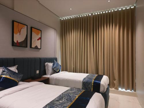 Postel nebo postele na pokoji v ubytování فندق جراند جرين